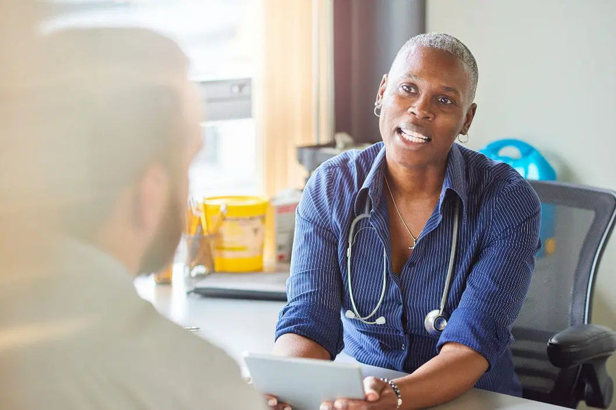 Doctor chatting with man